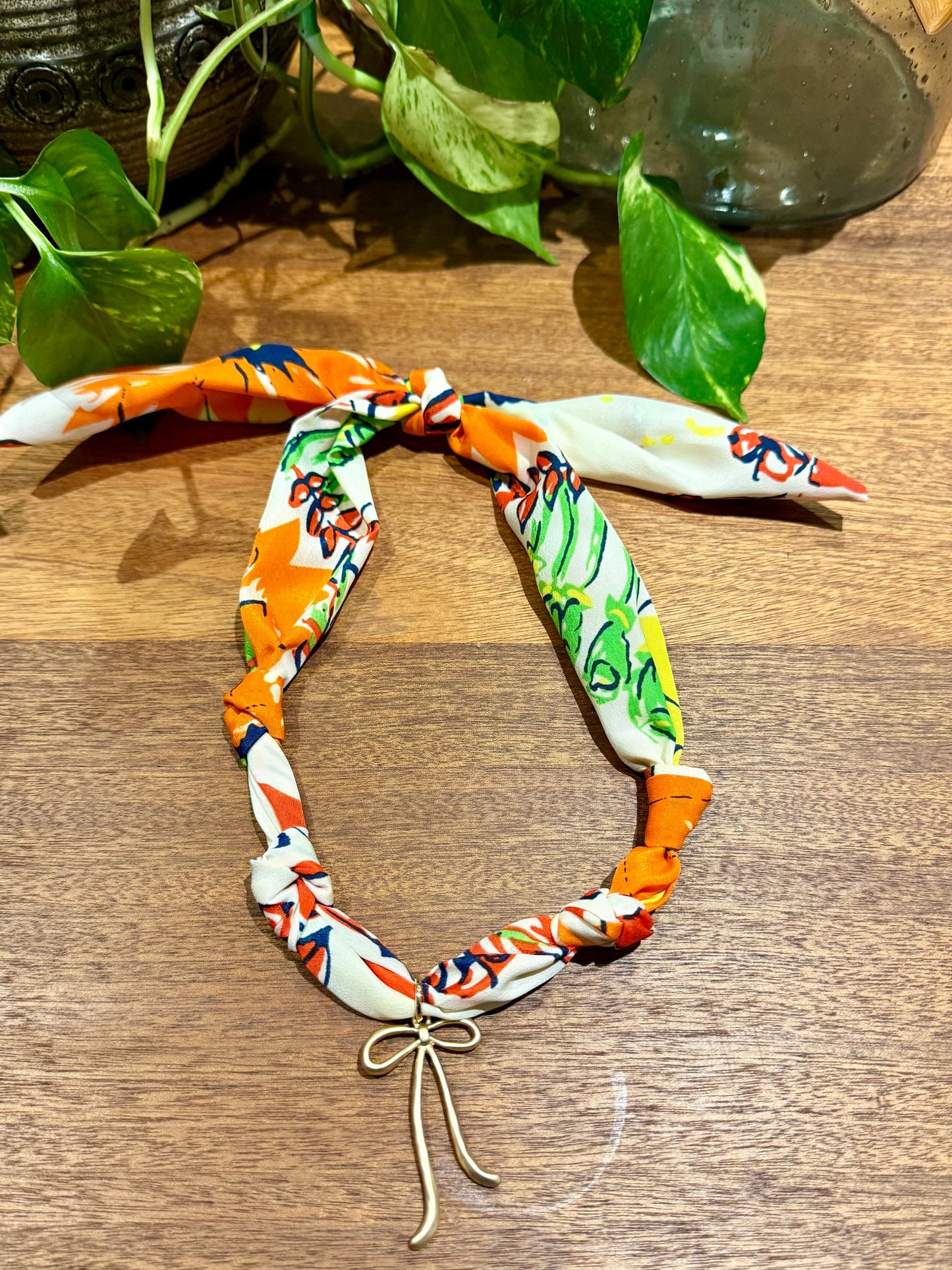 Orange Floral Scarf with Bow Charm